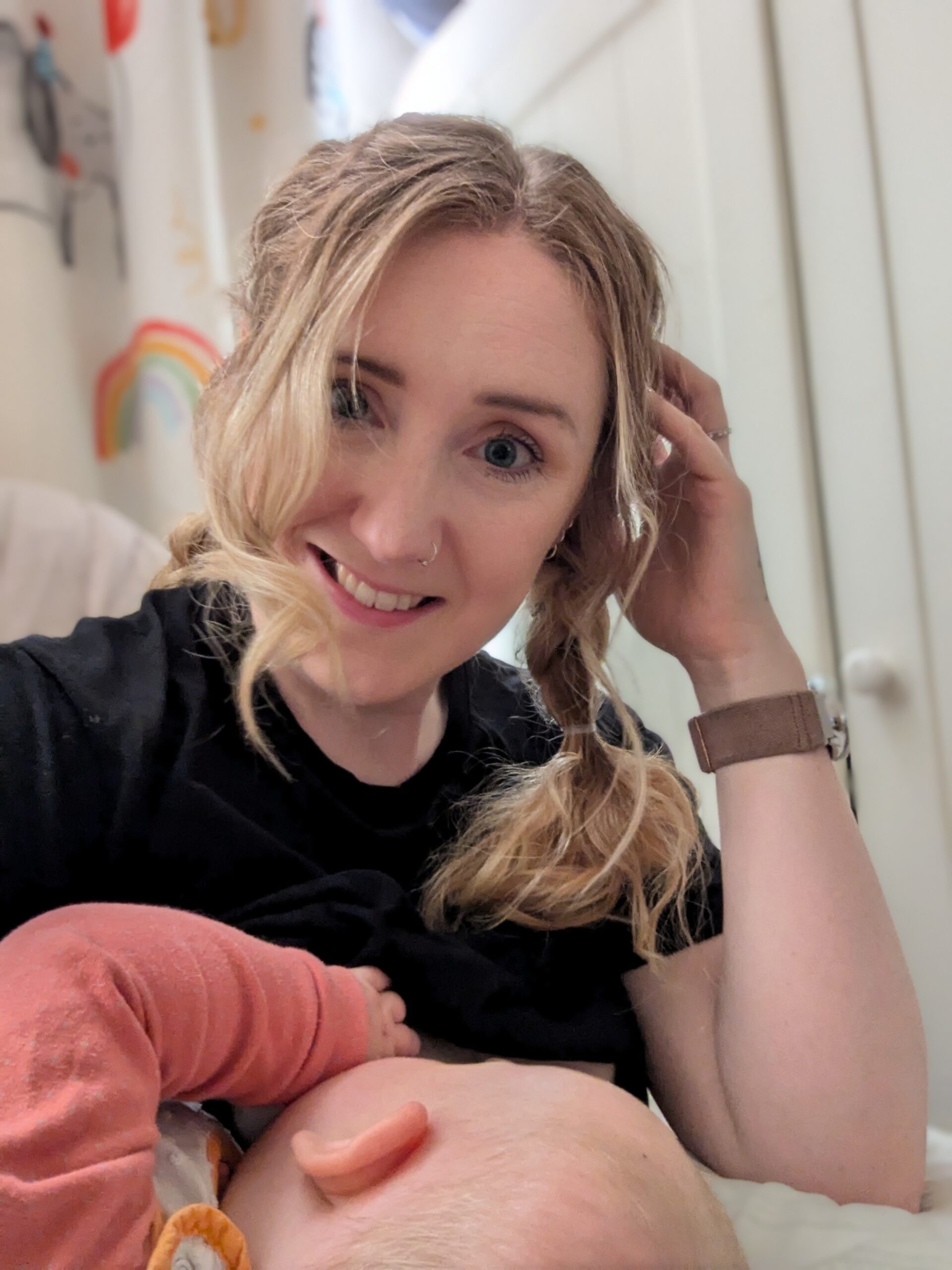 mum breastfeeding baby and cuddling